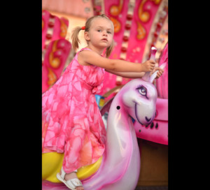 Girl on carousel